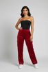 Velour track cargo pants in a red color